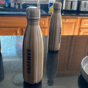 Light copper, metal water bottle with screw on cap. Samsung imprint in black New